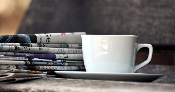 cup, newspapers, magazines